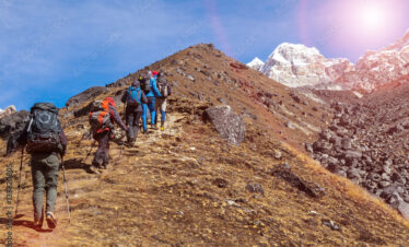 Mountaineering Expedition moving toward high Altitude Mountain Sunshine