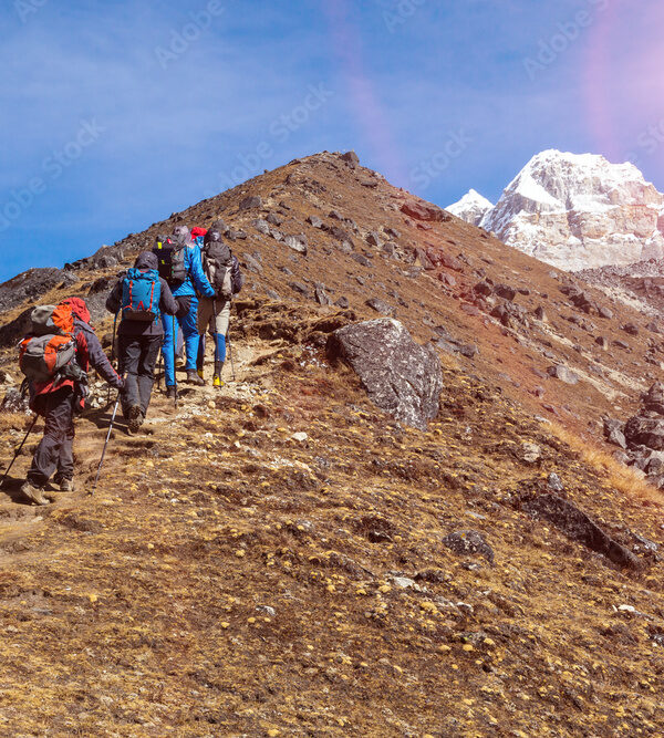 Mountaineering Expedition moving toward high Altitude Mountain Sunshine